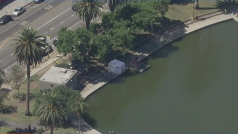 Mystery surrounds halted lake search involving weapons and remains